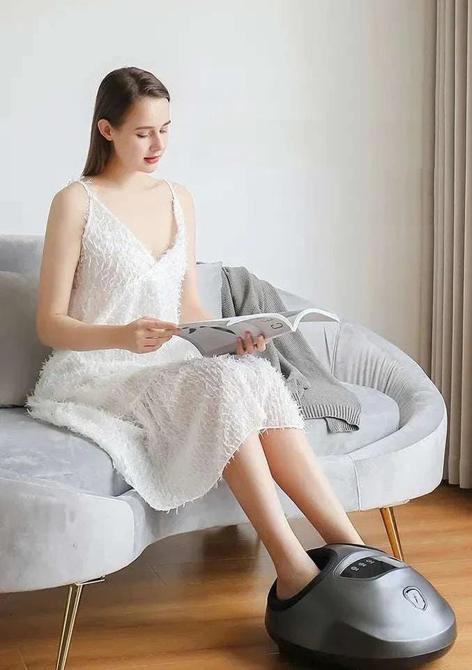 Shiatsu foot massager machine in use by woman, featuring air compression and deep kneading functions.